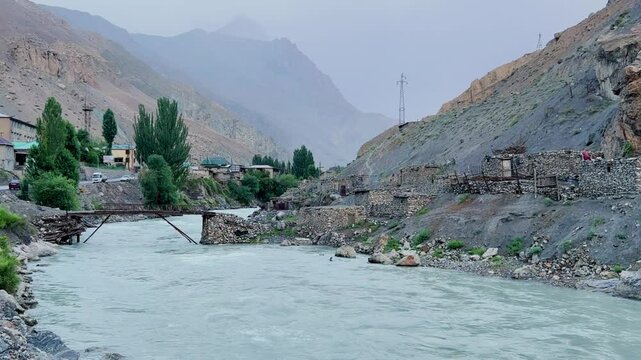 Old villages in Tajikistan. Tajikistan's road along the Zeravshan River near the Pamir highway. Old stone villages in the mountains of the Silk Road. 4К