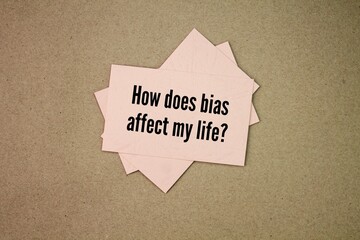 colored paper with the question words How does bias affect my life?