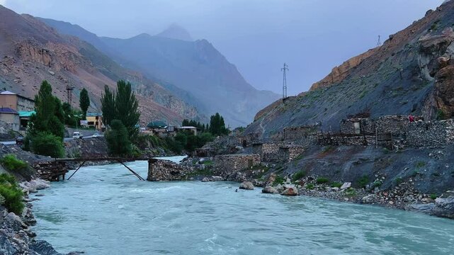 Old villages in Tajikistan. Tajikistan's road along the Zeravshan River near the Pamir highway. Old stone villages in the mountains of the Silk Road. 4К