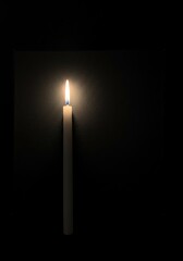 Solitary Candlelight: A Minimalist Darkroom Study