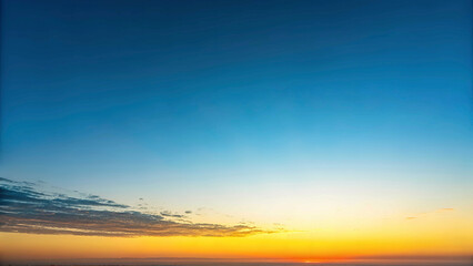 Fototapeta premium A serene gradient sky transitioning from blue to yellow