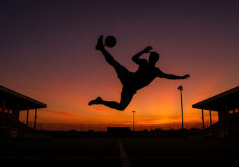 Silhouette athlete playing soccer sunset