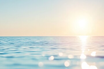 Tranquil ocean sunrise with calm waves and bright sunlight reflection