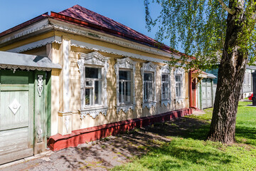 Wooden apartment building with carved architraves in Kolomna city, Moscow region