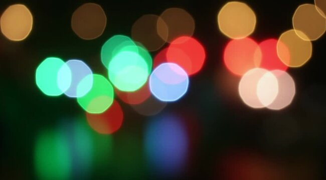 blurred christmas lights shining in the night