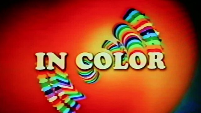 In color text in vintage, retro film or videotape era font and color style. Processed through videotape for authentic tape damage effect.