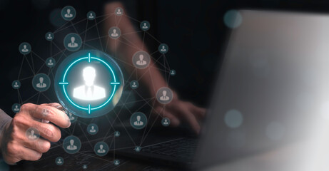 Human resources professional holding magnifying glass with people icon. Targeting or selecting suitable candidates in HR and recruitment. Human resources or HR concept.