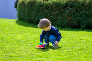 Child Sorting Colorful Easter Eggs