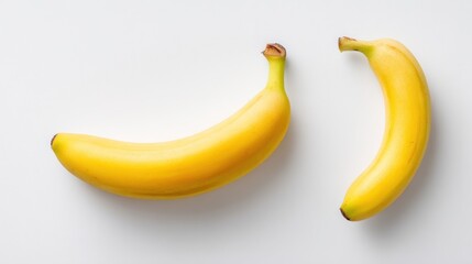 Two ripe bananas on a white surface (1)