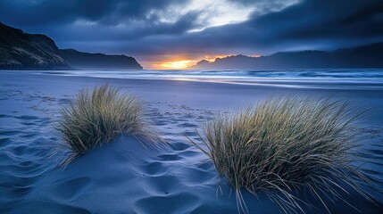 A serene beach scene at sunset, featuring gentle waves lapping against the shore.
