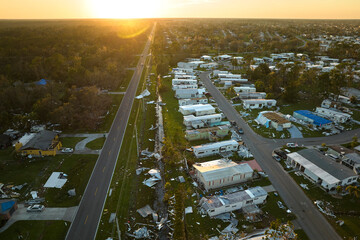 Badly damaged mobile homes after hurricane Ian in Florida residential area. Consequences of natural...
