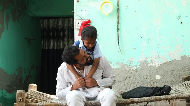 Happy rural indian father and little daughter in school uniform hug love and bonding. Parenthood, Education.