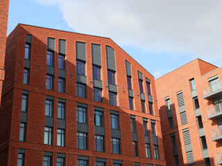 Contemporary Modern Red Brick Architectural Design Featuring in an Urban Setting and Landscape