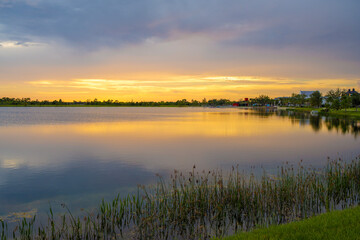 Evening landscape over lake water in southern tropical wetlands. Amazing Florida nature at sunset