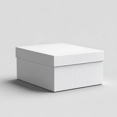 Fototapeta premium A clean white rectangular cardboard box sitting on a light gray surface