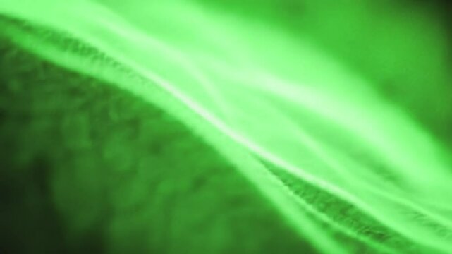 Enjoy a captivating display of green patterns resembling flowing waves, showcasing the interplay of light and motion in a mesmerizing digital environment.
