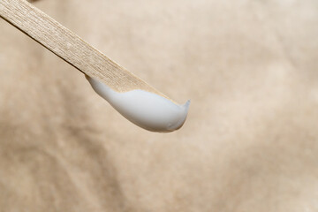 Face cream on a wooden stick
