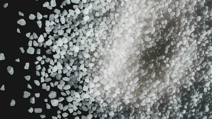 Macro shot of coarse white sea salt crystals, isolated on black background