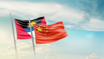 antigua and barbuda waving flag in beautiful sky.