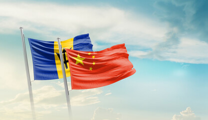 Barbados and China flags waving in beautiful sky. Two country flag for agreement or deal. Barbados...