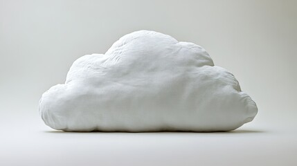 White cloud shaped fluffy pillow, isolated on white background. Comfort, softness, sleep concept.