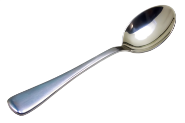 A shiny metal spoon with a long handle isolated against a black background in a close up shot