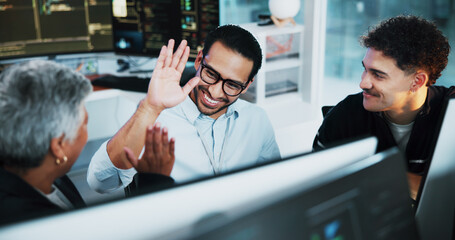 Web developer, high five and celebration in office for software, system or website update launch....