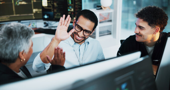 Web developer, high five and celebration in office for software, system or website update launch. Night, happy programmer and backend engineer for company development, teamwork or project on computer