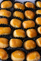 Kue Nastar and Putri Salju (Pineapple Tart and Snow-White Cookie) in a white box and background. Famous delicacy for Lebaran (Eid al-Fitr), Natal (Christmas), and Imlek (Chinese New Year) in Indonesia