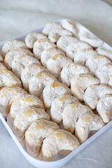 Kue Nastar and Putri Salju (Pineapple Tart and Snow-White Cookie) in a white box and background. Famous delicacy for Lebaran (Eid al-Fitr), Natal (Christmas), and Imlek (Chinese New Year) in Indonesia