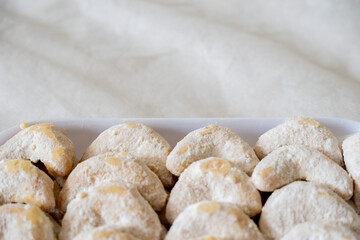 Kue Nastar and Putri Salju (Pineapple Tart and Snow-White Cookie) in a white box and background. Famous delicacy for Lebaran (Eid al-Fitr), Natal (Christmas), and Imlek (Chinese New Year) in Indonesia