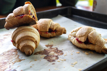 Homemade croissant with cherry jam. Dessert. Food. Pastry