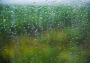 Water drops background, Rain drops on car window.