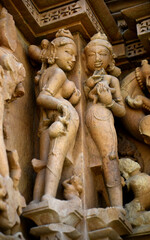 Obraz premium Sculpture of erotic woman on Khajuraho Temple.