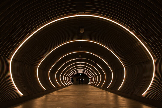 Zurich, Switzerland - March 27. 2022: The light tunnel connecting the new part of Zurich Airport shopping mall Circle and the flights area.