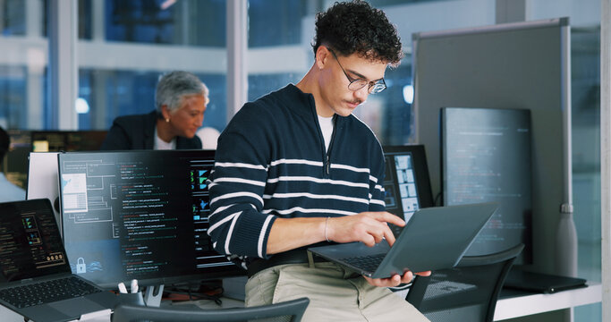 Man, programmer and office with laptop for coding, software development or app design. Male person, coder or developer with computer or technology for cybersecurity, web or IT services at workplace