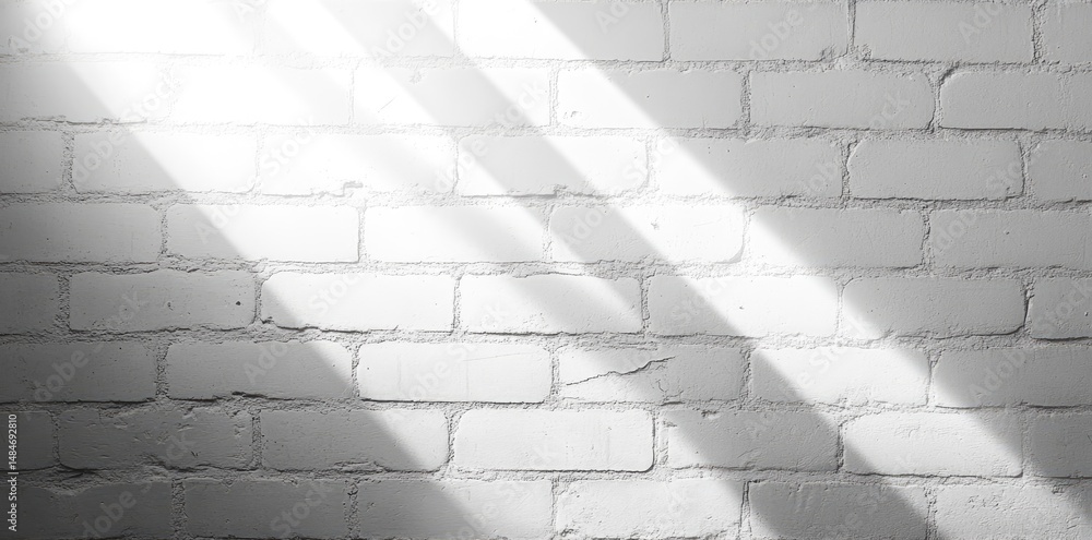 Poster a spotlight illuminates a textured white brick wall. creating dramatic shadows that enhance the visu