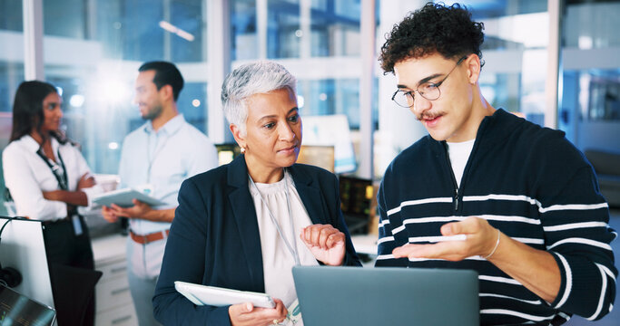 People, developer and mentor on laptop in office of programming, coding training and server update. Staff, manager and helping of app testing, IT intern and web application and troubleshooting system