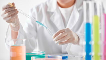 Fototapeta premium Hands Performing Scientific Experiments in a Modern Laboratory Setting.