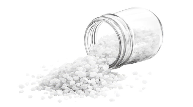 Coarse white crystals spilling from a tilted jar
