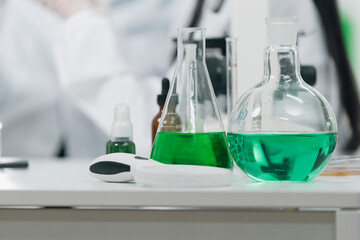 Medical research team conducting scientific experiments in a pharmaceutical laboratory, analyzing samples under microscopes to develop innovative medicine and healthcare solutions