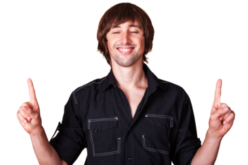 Man smiling with fingers raised in cheerful expression at bright studio