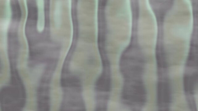 Blurry abstract green and grey pattern suitable for backgrounds, textures, and design elements in various creative projects and marketing materials.
