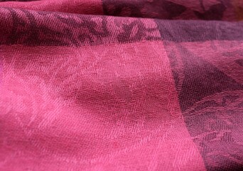 Dark pink cotton fabric macro.