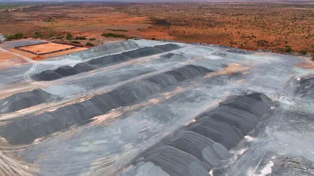 Piles of gray material due to mining at Port Headland in Australia. Drone shot.