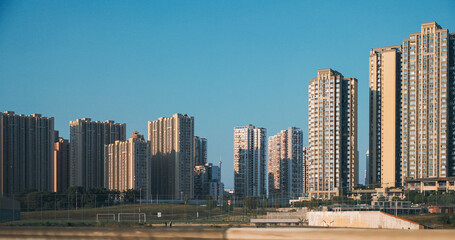 Fototapeta premium Chengdu, Sichuan, China. High-rise Houses Elevated View Cityscape Skyline. Urban Residential Areas. Chengdu Is Capital City Of Chinese Province Of Sichuan In Southwestern China. Clear Blue Sky. Real