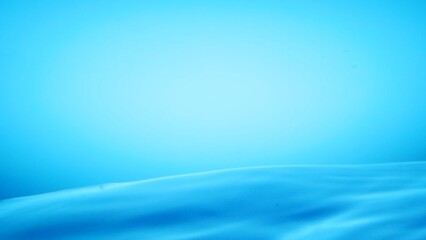 Serene Aqua: A gradient background showing serene water ripples, where a blend of tranquility, minimalist aesthetics, and the calm, fluid motion of water create a relaxing visual.