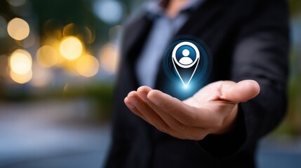 A businessman holding a glowing user location icon in his palm, symbolizing data access.