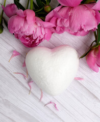 A red peony and a white heart in the background, a valentine