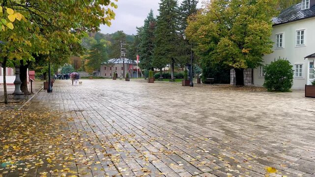 Dvorski trg in Cetinje Montenegro with wet autumn pavement